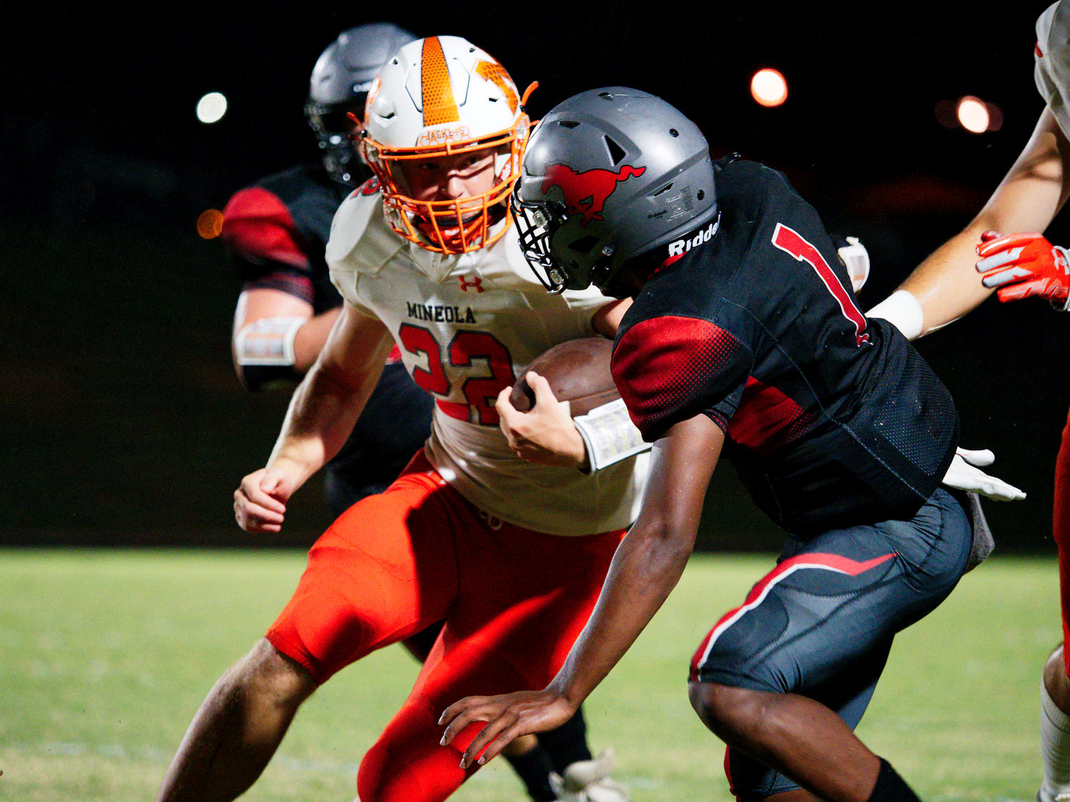 Dawson Pendergrass eyes the Mustang defender as he cuts back Sept. 2 at Hughes Springs.
